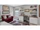 The home office space has a bright window, floating shelves, and a comfortable office chair at 208 Summerlin Ln, Haines City, FL 33844