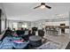 Spacious living area combining with dining and kitchen, boasting an open layout and modern design elements at 208 Summerlin Ln, Haines City, FL 33844