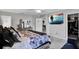 Comfortable main bedroom features soothing color palette, a TV, and carpeted floor at 208 Summerlin Ln, Haines City, FL 33844