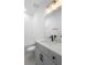 Well-lit bathroom featuring a white vanity with a white countertop, a bathtub, and modern fixtures at 2131 Brighton Ln, Orlando, FL 32817