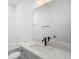 Well-lit bathroom featuring a white vanity with a white countertop, a bathtub, and modern fixtures at 2131 Brighton Ln, Orlando, FL 32817