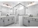 Clean, sleek bathroom with a frameless shower and dual sinks at 2131 Brighton Ln, Orlando, FL 32817