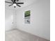 Well-lit bedroom with neutral carpet, ceiling fan and white walls that create a serene atmosphere at 2131 Brighton Ln, Orlando, FL 32817