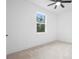 Bright bedroom with plush carpet, a window with natural light, and fresh white walls at 2131 Brighton Ln, Orlando, FL 32817