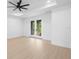 Large bedroom with natural light, ceiling fan and glass doors to the outdoor scenery at 2131 Brighton Ln, Orlando, FL 32817