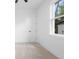 Bright bedroom with plush carpet, a window with natural light, and fresh white walls at 2131 Brighton Ln, Orlando, FL 32817