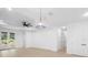 Open living room features neutral walls and ceiling fan with access to outdoor views at 2131 Brighton Ln, Orlando, FL 32817