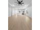 Open-concept living space with wood floors and a view of the kitchen featuring a center island at 2131 Brighton Ln, Orlando, FL 32817