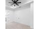 Spacious carpeted bedroom showing bathroom and closet door with white walls at 2131 Brighton Ln, Orlando, FL 32817