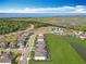 Beautiful aerial view of a subdivision with waterfront homes, lush landscaping, and stunning lake views at 2312 Panoramic Cir, Apopka, FL 32703