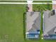 Aerial shot of the home showcasing manicured lawn, landscaping, roof and a screened pool at 2312 Panoramic Cir, Apopka, FL 32703