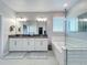 Modern bathroom features a double vanity, soaking tub, and subway tile at 2312 Panoramic Cir, Apopka, FL 32703