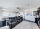 Second floor entertaining space with black leather theater seating and an adjacent dining area at 2312 Panoramic Cir, Apopka, FL 32703