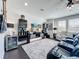 Entertainment room with theater-style seating, built-in shelving, and a ceiling fan at 2312 Panoramic Cir, Apopka, FL 32703