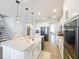 Spacious kitchen with large island, modern appliances, and ample counter space at 2312 Panoramic Cir, Apopka, FL 32703