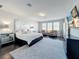 Spacious main bedroom features a sitting area, dark wood floors, and serene decor at 2312 Panoramic Cir, Apopka, FL 32703