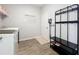 Functional mudroom with storage, coat rack, and easy access to laundry appliances at 2312 Panoramic Cir, Apopka, FL 32703