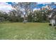 Large backyard featuring a mature shade tree at 237 Church St, Lake Helen, FL 32744