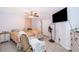 Bright, airy bedroom offers two beds, tile floors, and a ceiling fan for added comfort at 237 Church St, Lake Helen, FL 32744