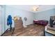 Guest bedroom with hardwood floors and ceiling fan at 237 Church St, Lake Helen, FL 32744