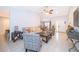 Inviting living room featuring vaulted ceilings, neutral walls, tile flooring, and stylish decor at 237 Church St, Lake Helen, FL 32744