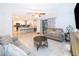 Spacious living room displays tile floors, modern furnishings, a breakfast bar and an open concept design at 237 Church St, Lake Helen, FL 32744