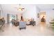 Bright and airy living room with vaulted ceilings, neutral walls, tile flooring, and contemporary furnishings at 237 Church St, Lake Helen, FL 32744