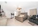 Spacious bedroom featuring tile floors, ceiling fan, and ensuite bathroom access at 237 Church St, Lake Helen, FL 32744