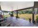 Covered patio area with tile flooring and backyard views at 237 Church St, Lake Helen, FL 32744