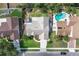 Beautiful backyard oasis featuring a pool, lush landscaping, and an outdoor entertaining space, creating a private retreat at 249 Mill Slough Rd, Oviedo, FL 32766