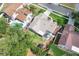 A perfectly landscaped property showcasing meticulous attention to detail, complemented by a private backyard pool at 249 Mill Slough Rd, Oviedo, FL 32766