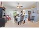 Dining room with neutral paint, tiled flooring, a ceiling fan, and stylish furnishings at 249 Mill Slough Rd, Oviedo, FL 32766