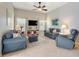 Inviting living room with neutral colors, tile floors, ceiling fan, and comfortable seating at 249 Mill Slough Rd, Oviedo, FL 32766