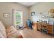 Office with wood-look flooring, natural light, and a desk area at 249 Mill Slough Rd, Oviedo, FL 32766