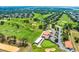 Beautiful aerial view of the golf course and clubhouse with well-manicured greens and lush landscaping at 2498 Saint Augustine Blvd, Haines City, FL 33844