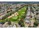 Stunning aerial view of a golf course, green lawns, houses, and lush greenery at 2498 Saint Augustine Blvd, Haines City, FL 33844