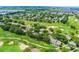 Aerial view of golf course homes with lush greenery, manicured fairways, and water hazards at 2498 Saint Augustine Blvd, Haines City, FL 33844