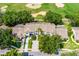 Aerial view of townhomes surrounded by lush landscaping and golf course at 2498 Saint Augustine Blvd, Haines City, FL 33844