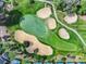 Attractive aerial view of golf course hole with lush greenery, sand traps, and walking path at 2498 Saint Augustine Blvd, Haines City, FL 33844
