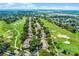 Scenic aerial view of golf course homes with mature trees, lush greenery, and water views at 2498 Saint Augustine Blvd, Haines City, FL 33844