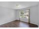 This bedroom features hardwood floors and a large window at 2498 Saint Augustine Blvd, Haines City, FL 33844