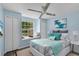 This bright bedroom features a ceiling fan and window seat for enjoying natural light at 2498 Saint Augustine Blvd, Haines City, FL 33844
