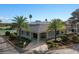 Charming community center featuring inviting entrance, landscaping, and palm trees in clear blue skies at 2498 Saint Augustine Blvd, Haines City, FL 33844