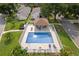 Aerial view of a fenced-in community pool and gazebo surrounded by lush landscaping at 2498 Saint Augustine Blvd, Haines City, FL 33844