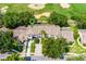 Aerial view of townhomes with lush landscaping and a golf course in the background at 2498 Saint Augustine Blvd, Haines City, FL 33844