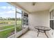 This screened patio overlooks a golf course at 2498 Saint Augustine Blvd, Haines City, FL 33844