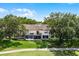 Townhome with an outdoor balcony, screened lanai and a golf course in the back at 2498 Saint Augustine Blvd, Haines City, FL 33844