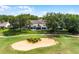 An aerial view of a townhome with golf course views and a screened in lanai at 2498 Saint Augustine Blvd, Haines City, FL 33844