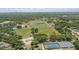 Aerial view featuring the community's sports fields, tennis courts, and surrounding landscapes at 2756 Summerfield Rd, Winter Park, FL 32792