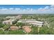Aerial view of the community highlighting lush landscaping and nearby buildings at 2756 Summerfield Rd, Winter Park, FL 32792